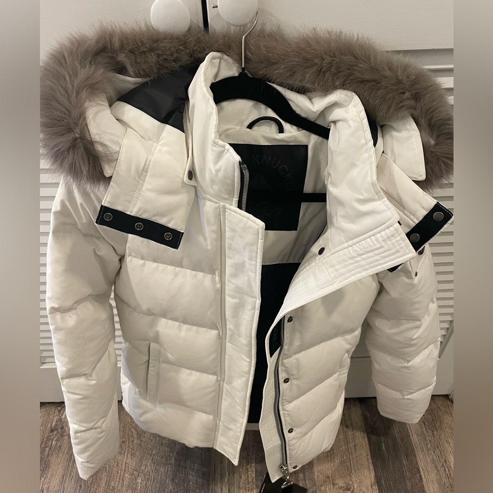 White womens moose knuckles jacket.